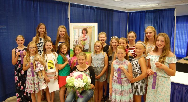 group of girls holding ribbons at state fair 4-H competition