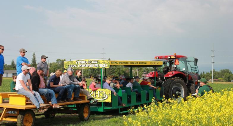 Picture of people sitting on the peoplecarriers at an annual LREC Field Day event.